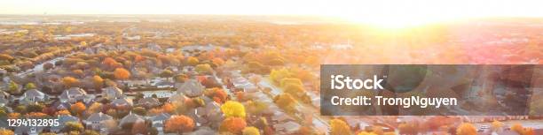 Panoramic View Flying Over Suburban Neighborhood At Sunset With Beautiful Autumn Leaves In Coppell Texas Usa Stock Photo - Download Image Now