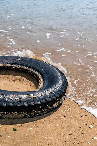 Black tires on the beach