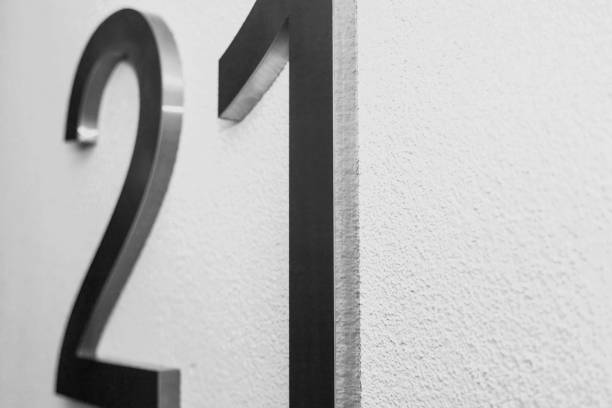istock Number twenty one on texture light wall, symbolizing year 2021 1294134894