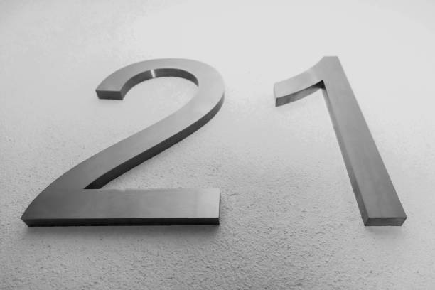 istock Number twenty one on texture light wall, symbolizing year 2021 1294134910