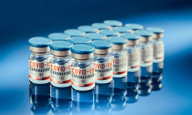 istock Covid-19 vaccine in small bottle in a row 1294135638