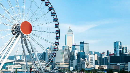 Ferris wheel and blue sky on background