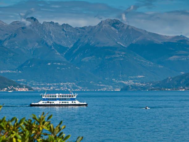 istock view of Lake Como, mountains, blue sky with white clouds and ferry 1294138923
