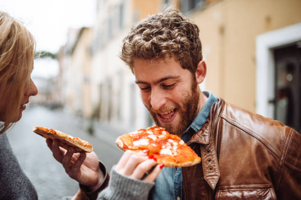 istock friends eating pizza in italy 1294140476