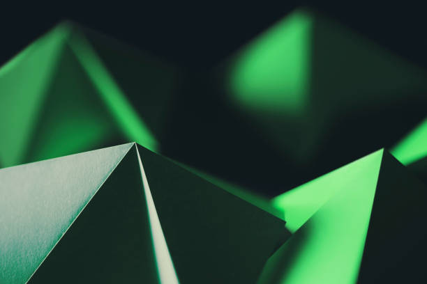 istock Green shapes on black, abstract background 1294141679