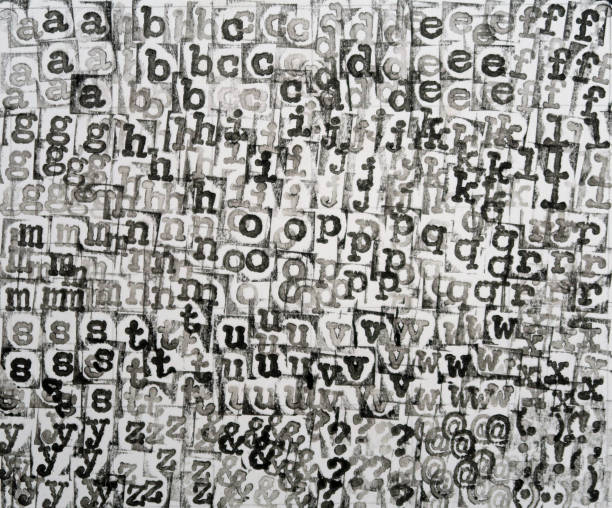 Background abstract pattern. Printed in layers in a hidden grid on a card. Vintage typewriter font alphabet letters in alphabetical order with assorted punctuation.  Black and white. Hand printed and owned by me (Laurence Berger) Essex, United Kingdom, December 2020