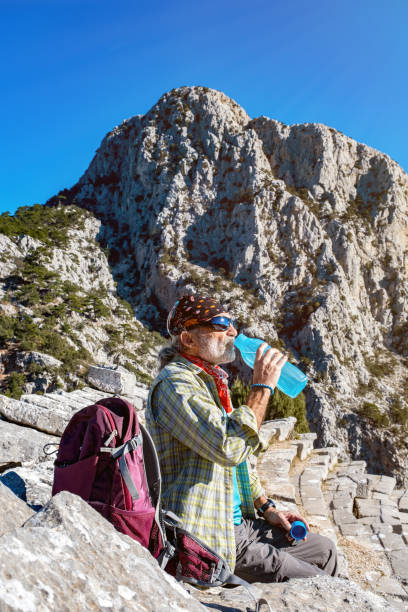 istock Man taking a break in the ancient theater 1294144560