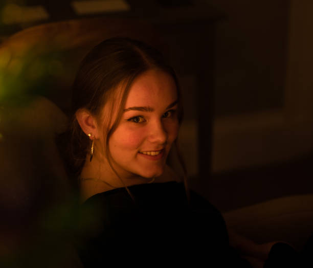 istock Smiling girl with mood lighting 1294145576