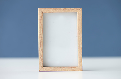 Picture frame against blue background.