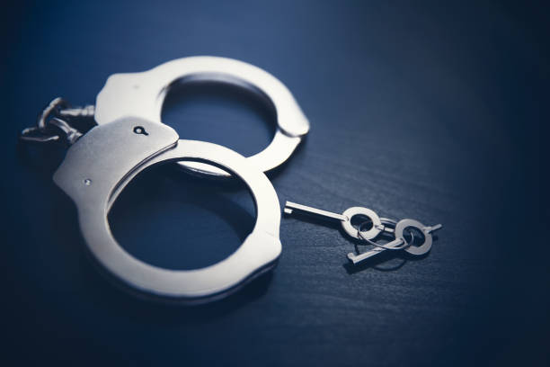 istock Crime and violence concept with handcuffs 1294150948