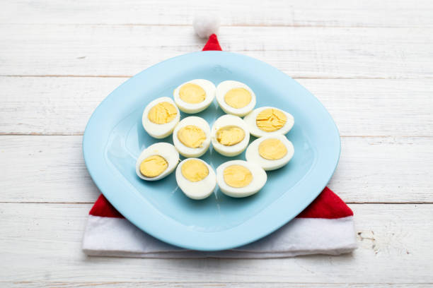 istock Boiled chicken eggs and a Santa hat. 1294154525