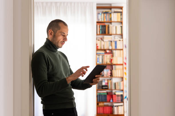 istock Concerned man consulting his Tablet 1294157413