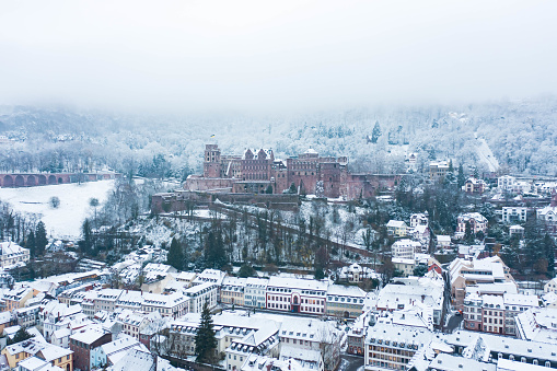 A December storm leaves the Heidelberg Castle surrounded by snow. This famous castle is located in the Heidelberg Altstadt in southern Germany.