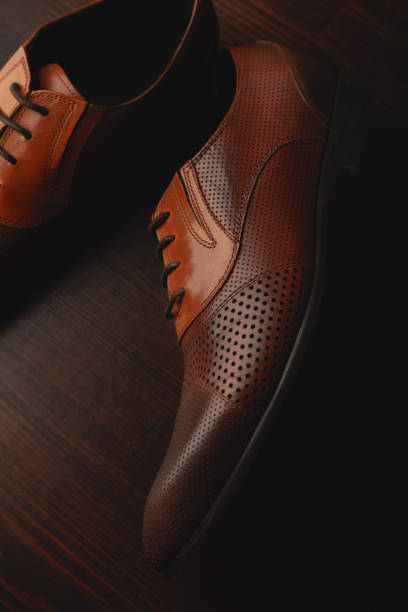istock Men shoes on wooden background 1294160691