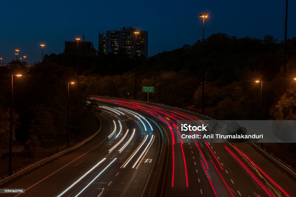Traffic on a highway Light trails on a highway in Toronto at Dusk Toronto Stock Photo