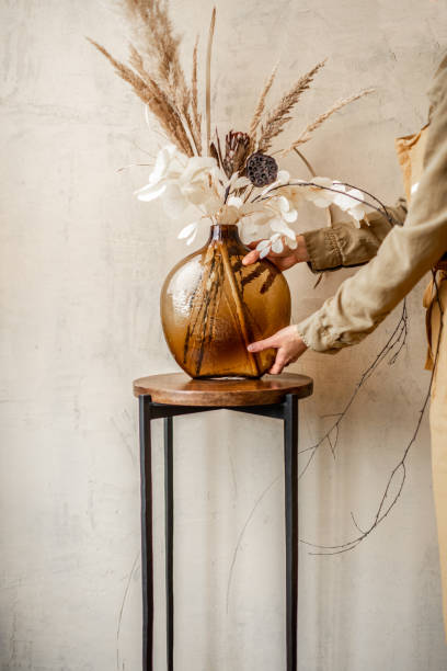 istock Dried Calluna flower in a gold vase 1294160977