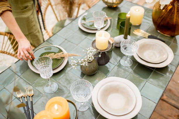 istock Female decorating dinning table in natural style outdoors 1294162030