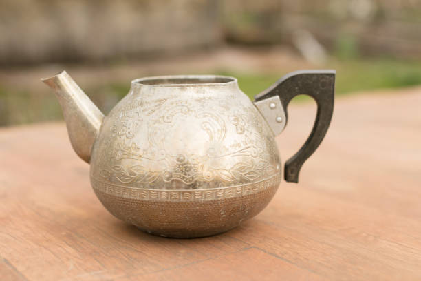 istock an old metal teapot without a lid. silver color 1294162135