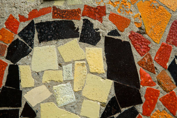 istock colored mosaic and round tile pattern on the old wall. decorative mosaic in white, yellow and black colors 1294164285