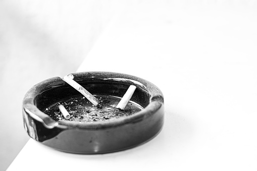 Health representation of ashtray from smoking in black and white, b&w, monochrome. portacenere.