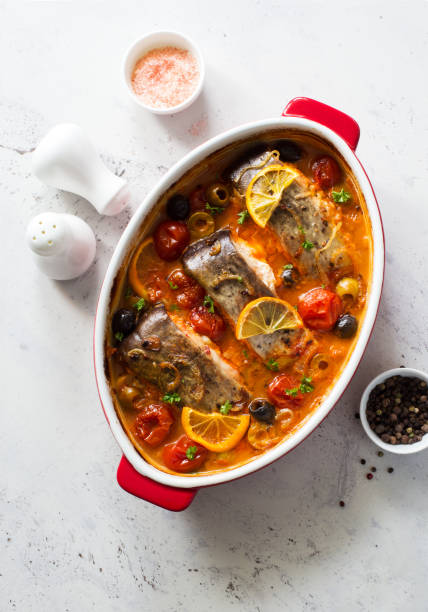 Fish steaks, olives and cherry tomatoes stewed  in tomato sauce