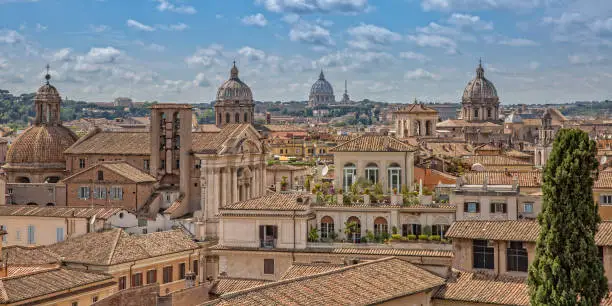 City skyline with Saint Peter Basilica in the background in a summer day, Rome, Italy