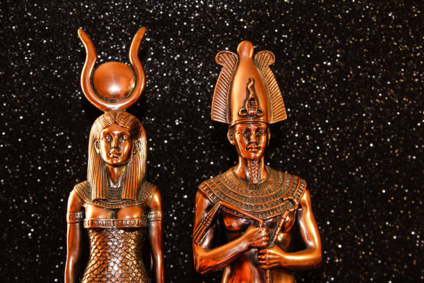 Pharaoh Tutankhamun with the goddess ISIS on a black background. Egyptian history.
