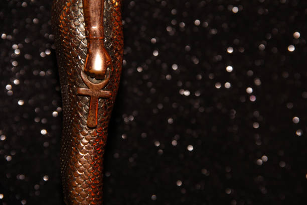 istock Bronze cross at the statuette on a black background. 1294173480