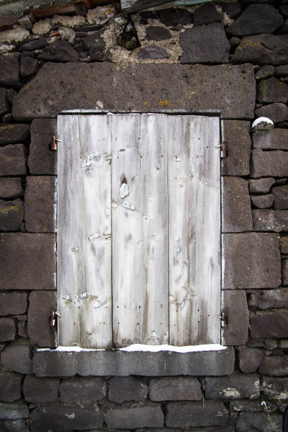 istock Boarded up window in an abandoned village house 1294175352
