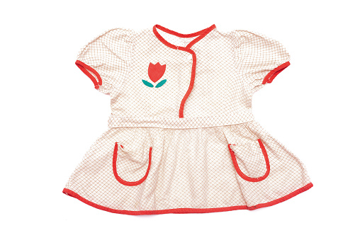 Old retro style children girl dress isolated on the white background.