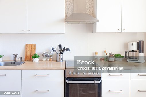istock Scandinavian classic minimalistic kitchen with white and wooden details. Modern white kitchen clean contemporary style interior design 1294177453