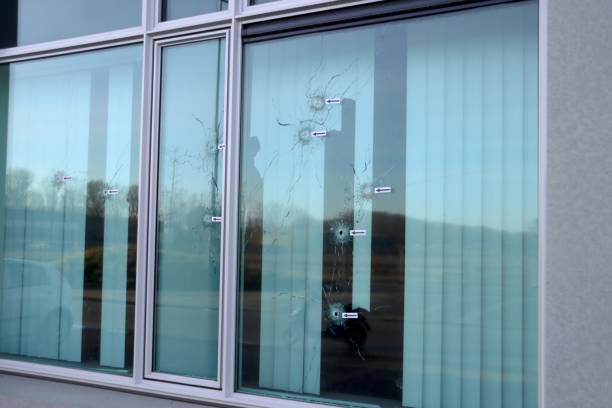 istock Bullet holes in windows, doors and wall after attac 1294184216