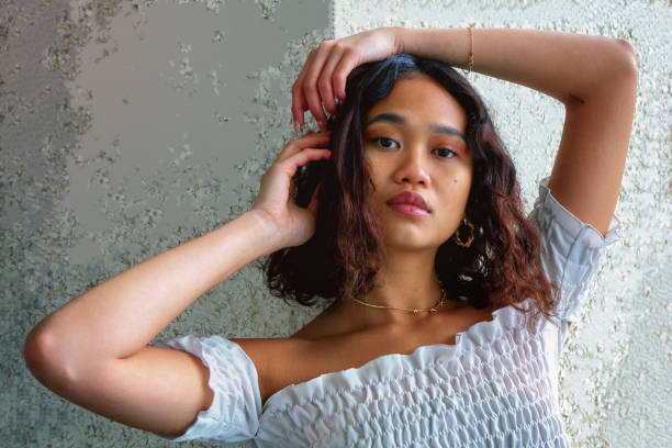 istock Attractive Indonesian beauty frames face with her arms 1294184911