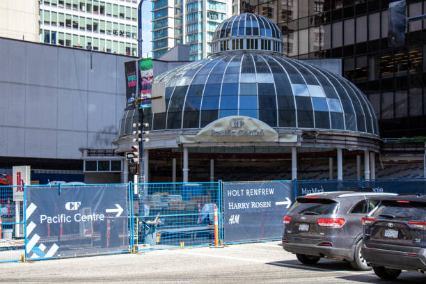 Close up View of the Pacific Centre under construction surrounded by fence on Howe Street in Vancouver stock photo