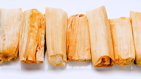 Mexican Tamales from Above in a row on white background