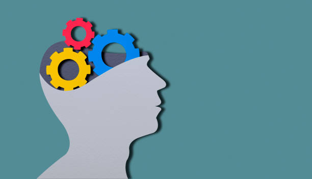istock Paper Cut Human Head With Colored Gears And Cogs 1294191044