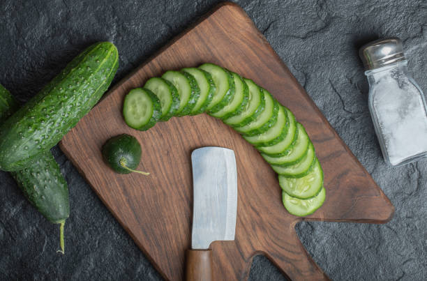 istock Sliced fresh, organic cucumber on wooden board 1294193270
