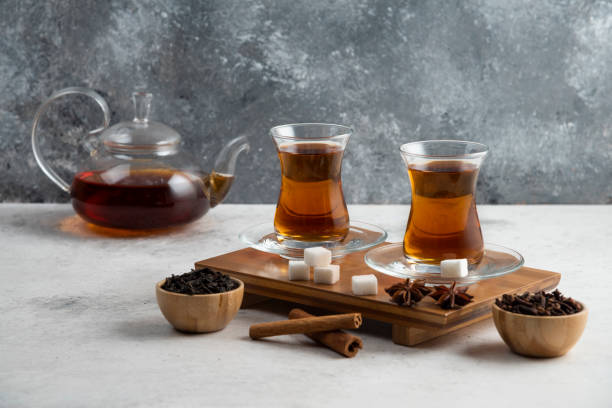 istock Two glasses cup of tea with sugar and star anise 1294196404