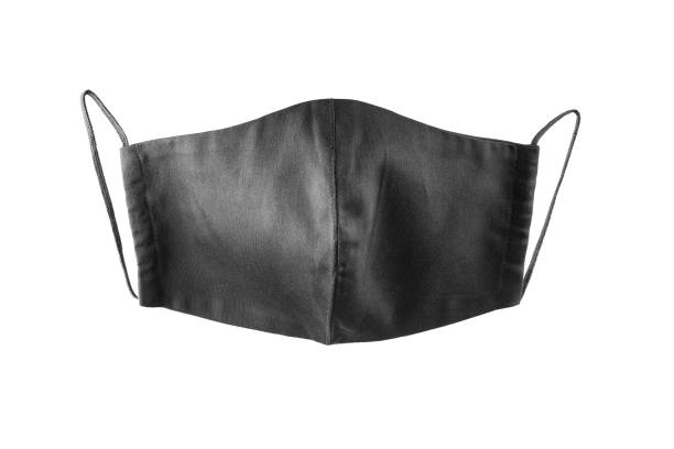 istock Black face protective mask isolated on a white background. Reusable cloth mask isolated. Face antivirus mask made from cotton. Isolate 1294196544