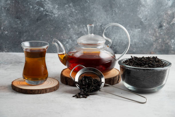 istock A glass teapot with tea on a wooden board 1294197105