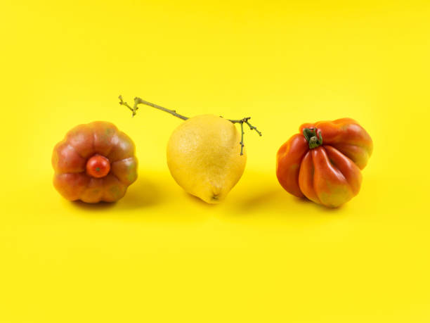istock Ugly fruit and vegetables on yellow background 1294201507