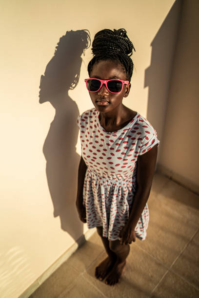 White sunglasses on pink background