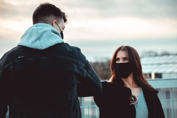 istock Young Couple Elbow Bump Covid-19 Corona Welcome Greeting 1294202083
