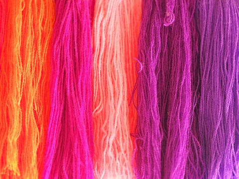 Yarn, several colors arranged abstract Gradient for background, Garn colorful pink orange red purple violet gold o-rose dark and soft color