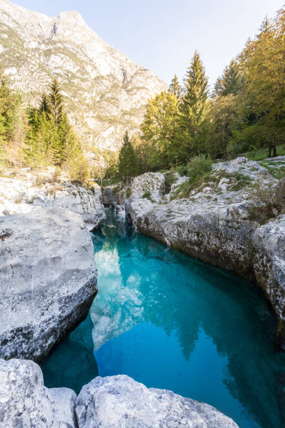 istock Impressive cliff and rocks at Soca River with crystal clear turquoise blue water. Kranjska Gora, Slovenia, Julian Alps, Soča, Vršič Pass 1294204552