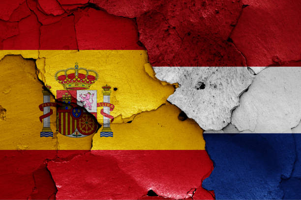 istock flags of Spain and Netherlands painted on cracked wall 1294205328