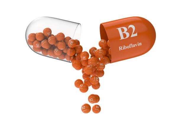 istock Open capsule with riboflavin from which the vitamin composition is pouring 1294205971