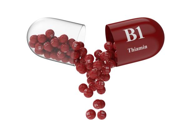 istock Open capsule with thiamin from which the vitamin composition is pouring 1294205974