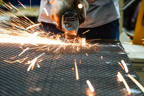 istock Electric iron grinding machine in factory Sparks from grinding wheels 1294214565
