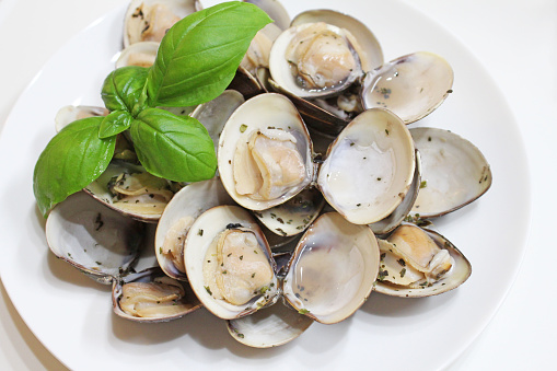 Clams steamed with basil and wine.